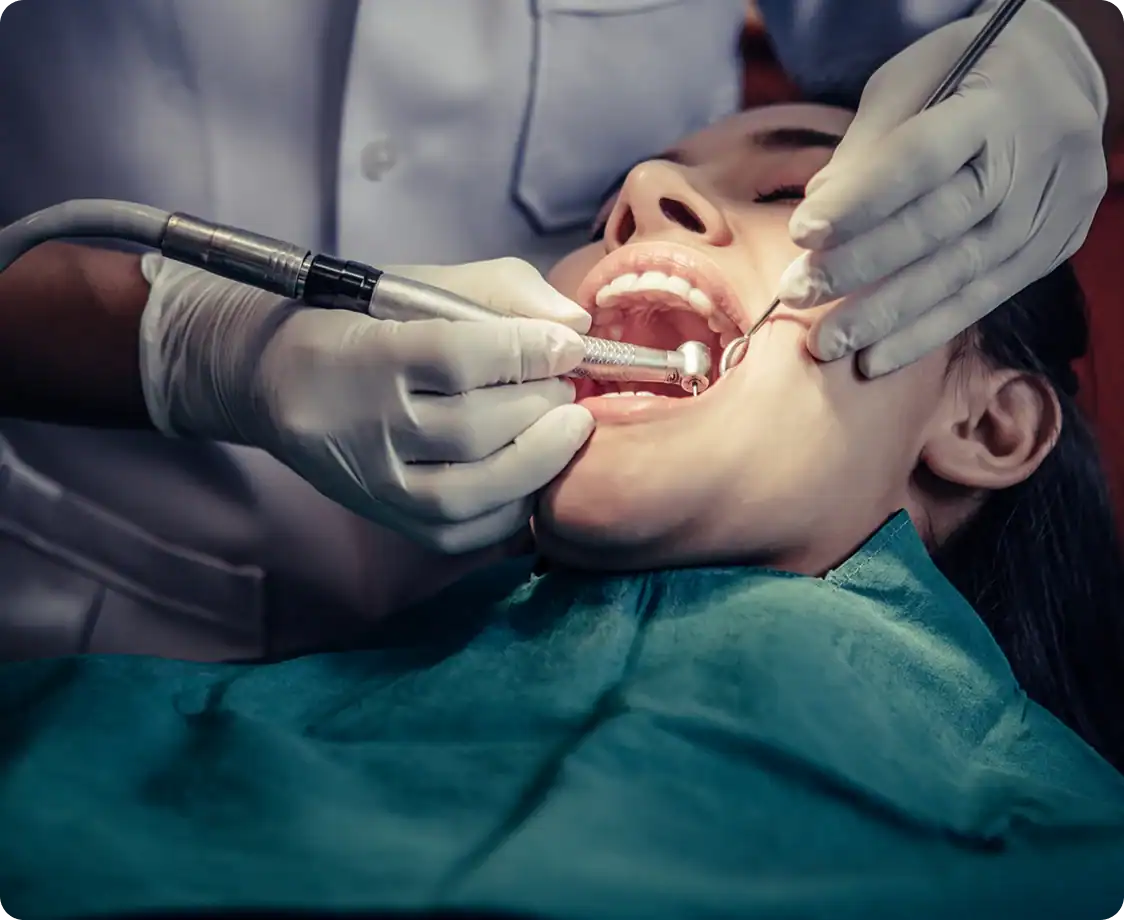 Dentist examining elderly patient's teeth