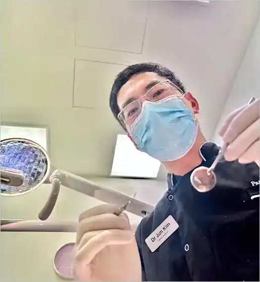 Dentist holding tools in clinic