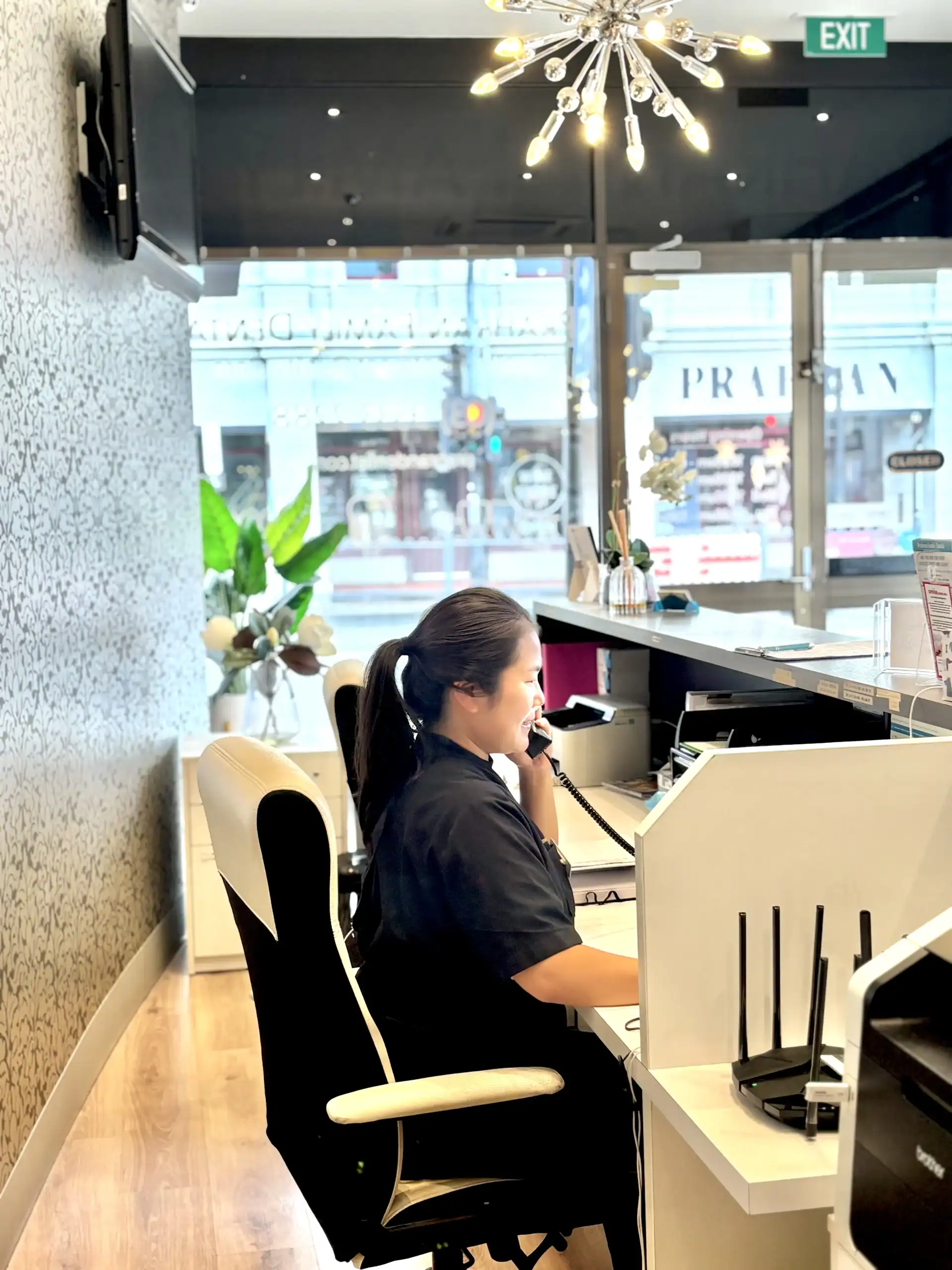 Receptionist at modern office desk