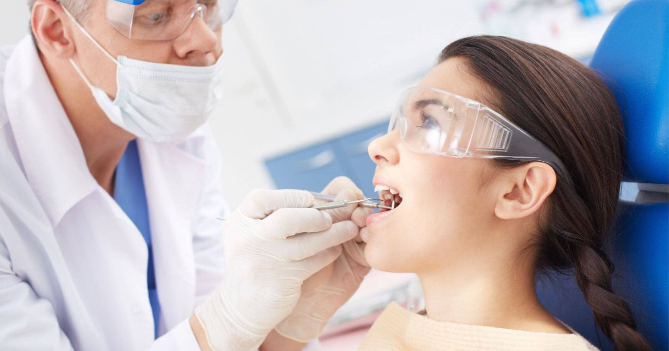 Dentist assessing gum health in Prahran