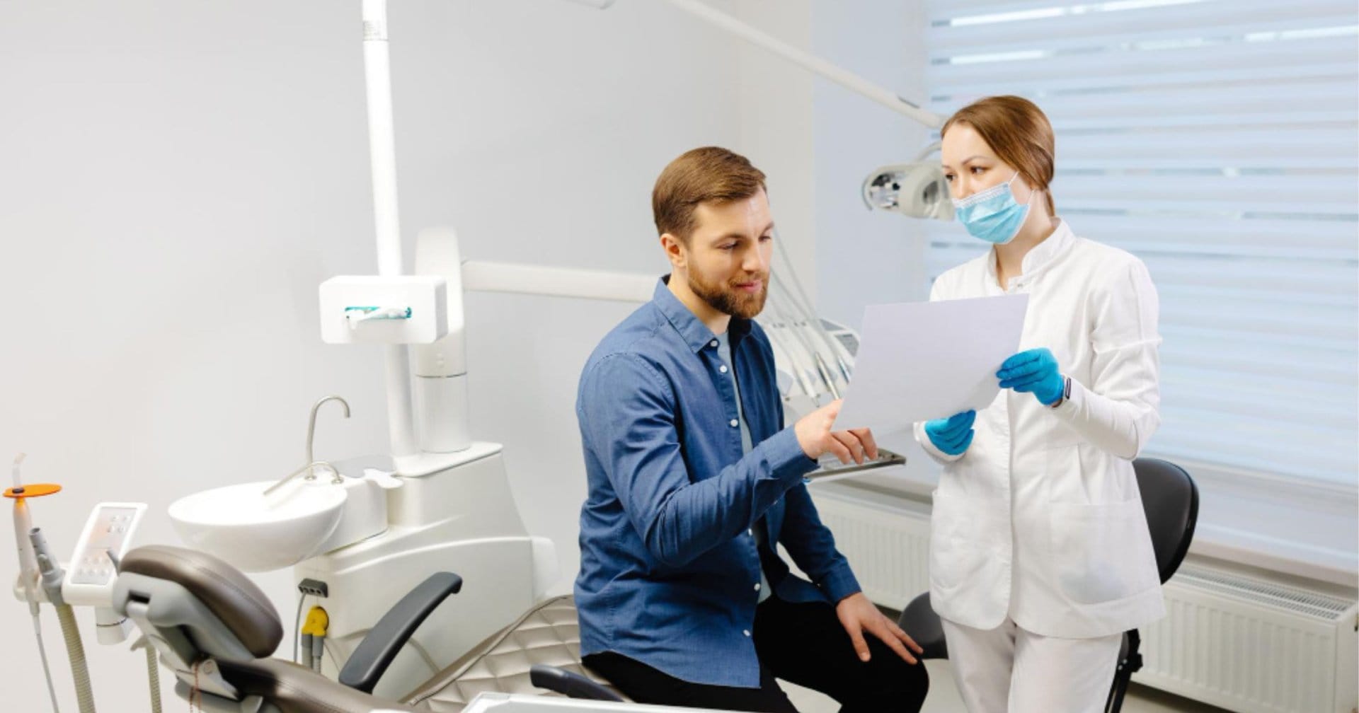 Dentist discussing chipped tooth repair options with a patient in Prahran