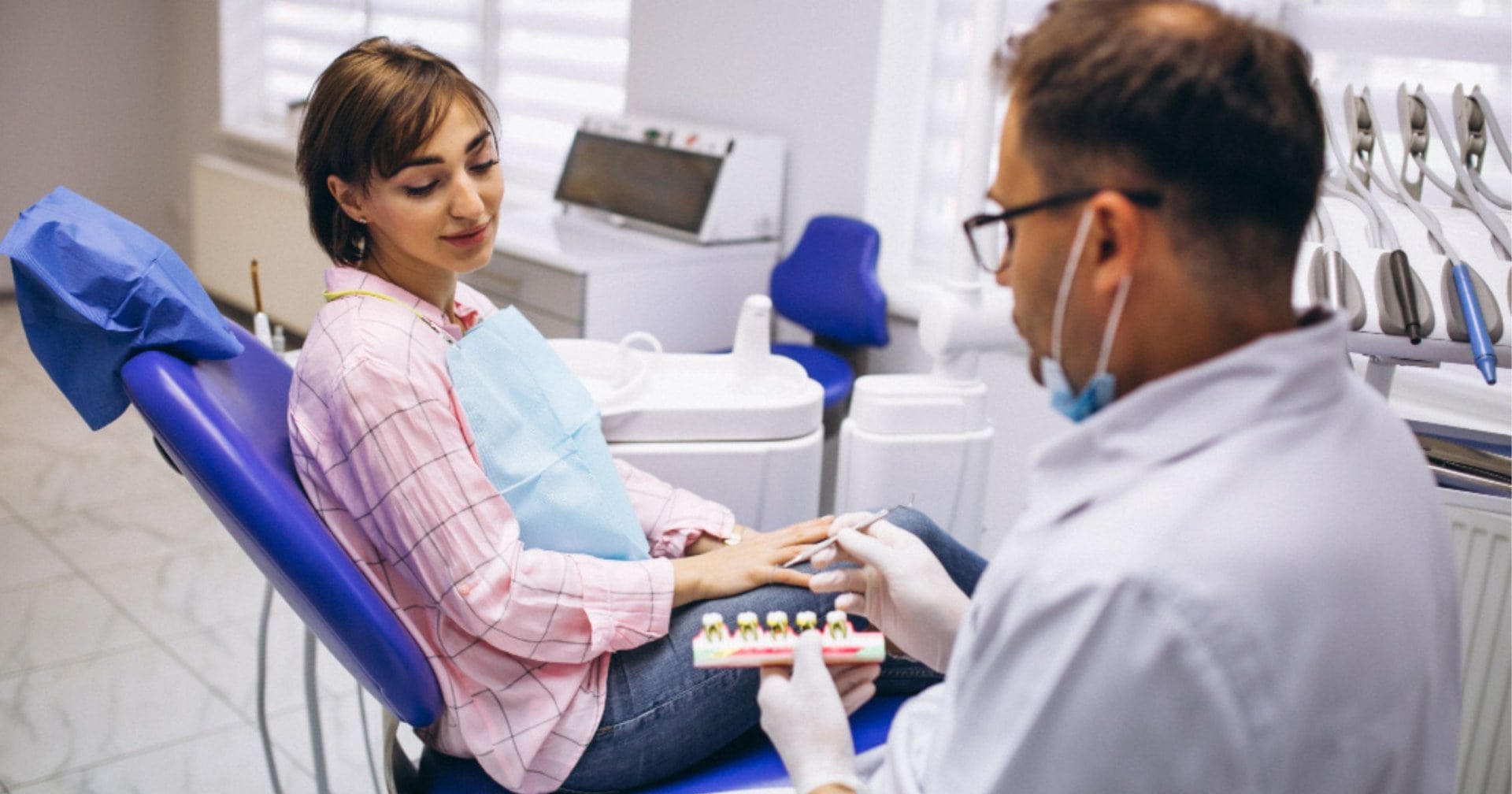 Dentist discussing dental crown treatment with a patient in Prahran