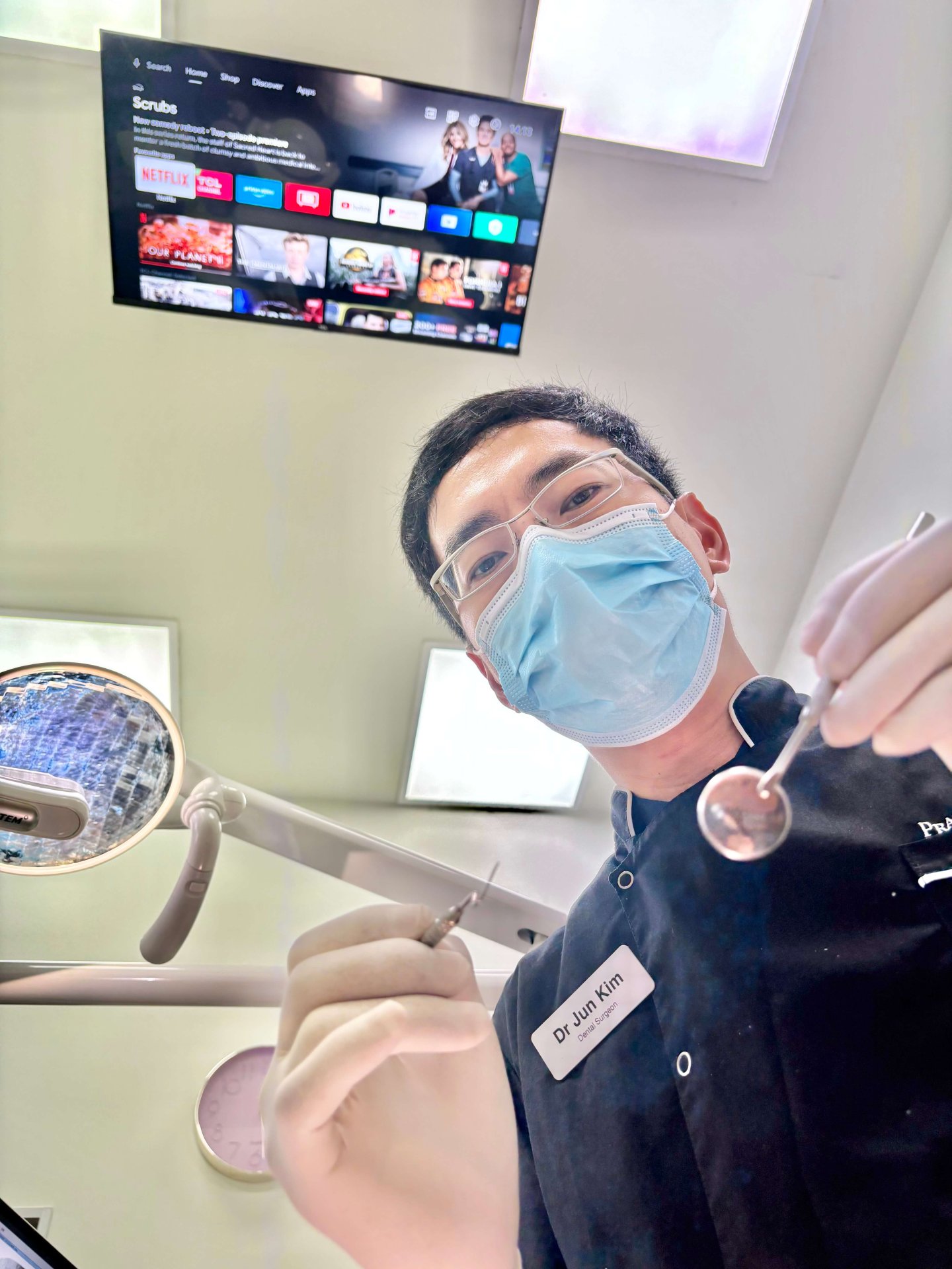 Dr Jun Kim performing a dental check up in Prahran