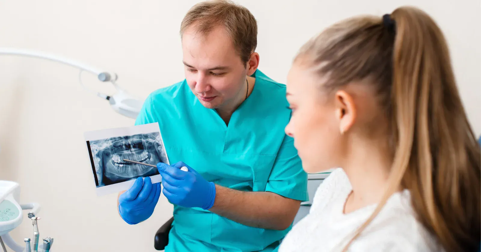 Dental X-ray being reviewed by a dentist and patient in Prahran