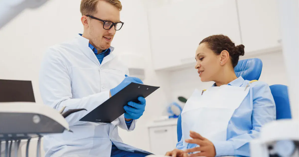 Dentist discussing a treatment plan with a patient in Prahran